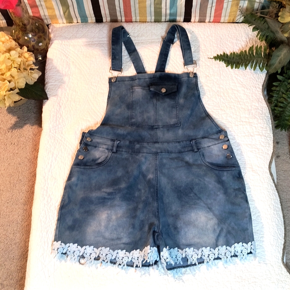 Denim Short Overalls with White Lace on at the Hem.